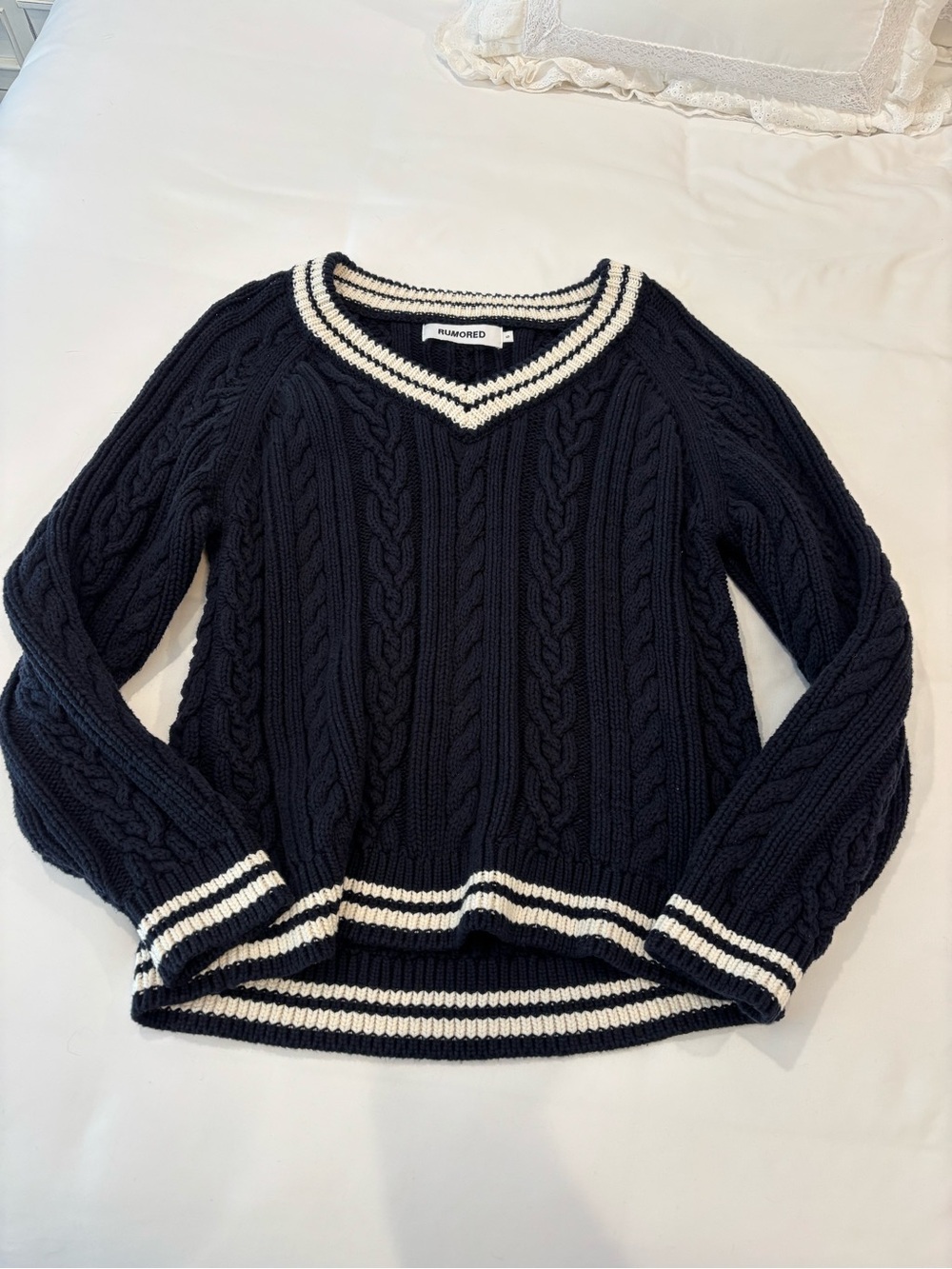 rumored navy cable knit sweater with white striped trim